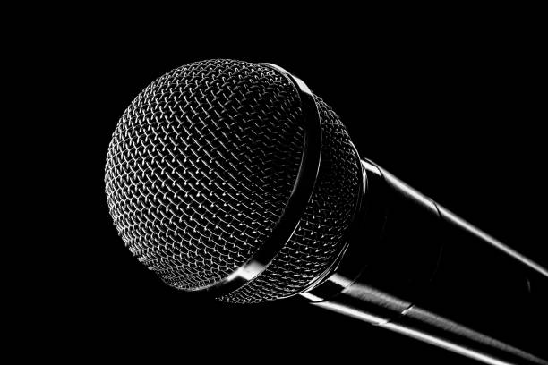 istock Round concert microphone close-up on black background. Musical equipment for performers. Topic of broadcasting 1390101853