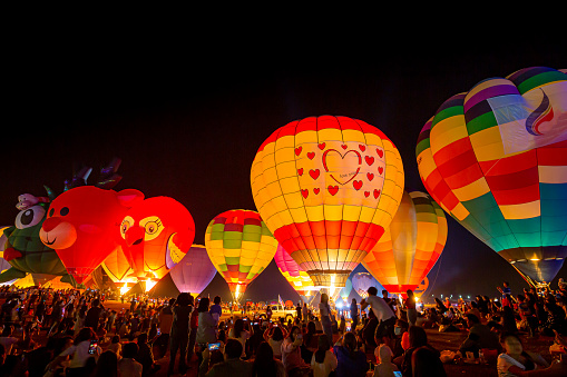 Chiang Rai, Thailand: 15 - February 2020: Night atmosphere of the 5th International Balloon Festival in Chiang Rai Province, Thailand.