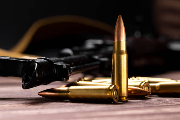 istock Bullets against Kalashnikov assault rifle 1390103279