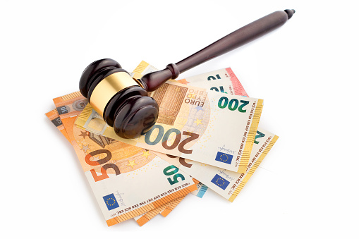 Gavel and euro notes - isolated on white background