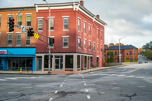 Augusta, Maine - October 16, 2021: Brightly colored store fronts and buildings in the historical Main Street in the city of Augusta, Maine