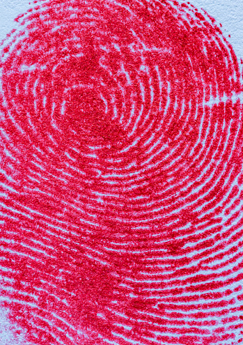 Red fingerprint on white paper