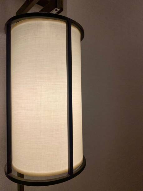 istock Cozy desk lamp in a room 1390106035