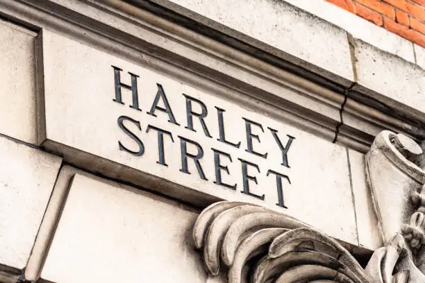 A sign for Harley Street in London, UK. The street is famous for being the traditional home of many private medical clinics.