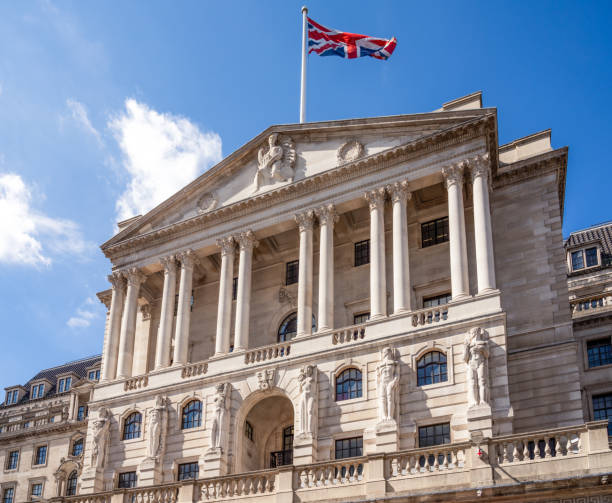 Bank of England headquarters - City of London A Union flag flying over the Bank of England, the central bank of the United Kingdom, located on Threadneedle Street in the City of London. bank of england stock pictures, royalty-free photos & images
