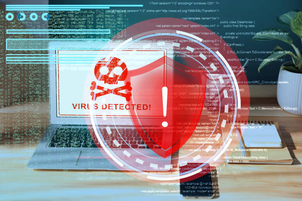istock Warning about virus attack on laptop screen. Workplace in office 1390106522