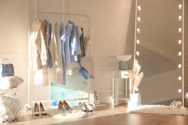 istock Dressing room interior with clothing rack and mirror 1390107179