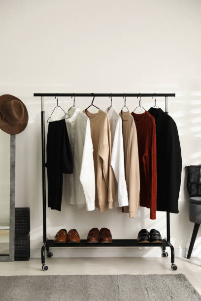 istock Rack with stylish men's clothes indoors. Interior design 1390107268