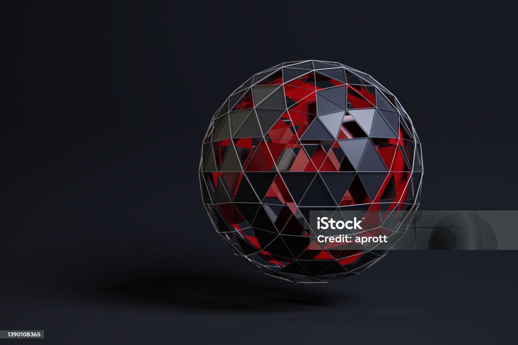 Abstract sphere consisting of rimmed black triangles wirh some holes. A second sphere in red inside. Dark background Abstract Stock Photo