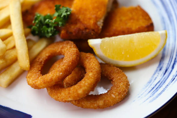 Dolly Fish Steak Breaded Served with lemon fries, sliced onions, crispy bread crumbs and mayo