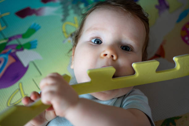 istock Baby lying on the floor 1390108793