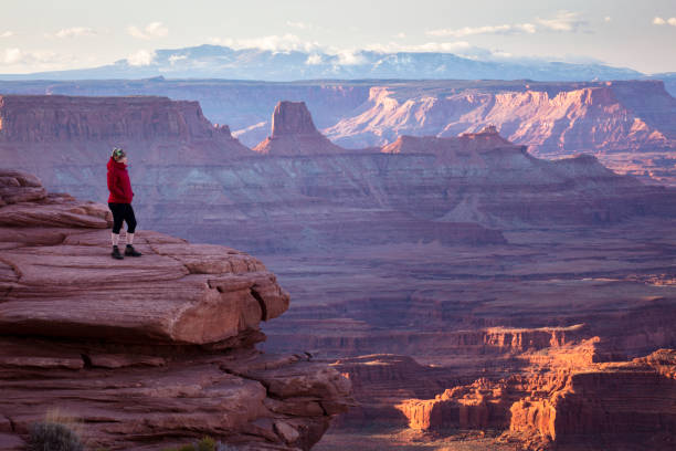 istock Hiker overlooking canyons at sunrise 1390109039