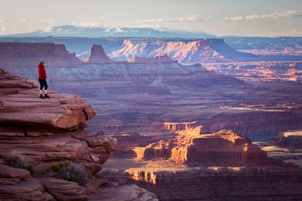 istock Hiker overlooking canyons at sunrise 1390109062