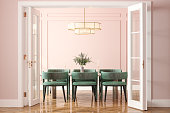 istock Entrance Of Dining Room With Dining Table, Green Velvet Chairs And Pink Wall In Background 1390110775