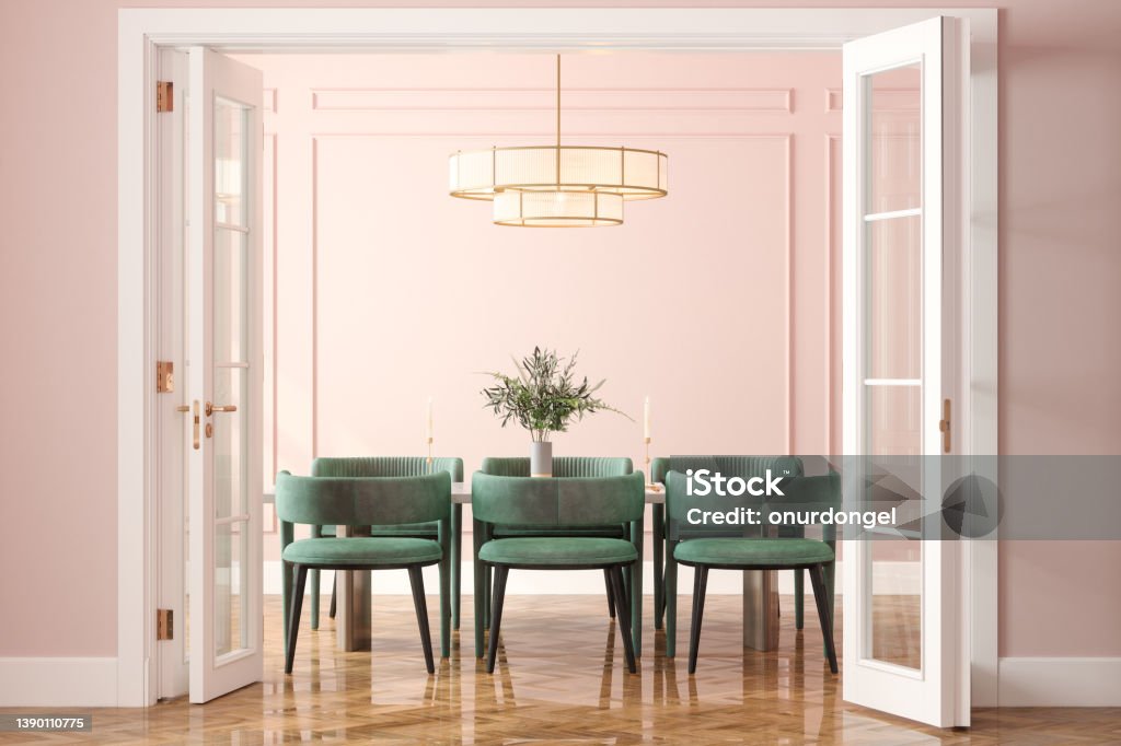 Entrance Of Dining Room With Dining Table, Green Velvet Chairs And Pink Wall In Background Dining Room Stock Photo