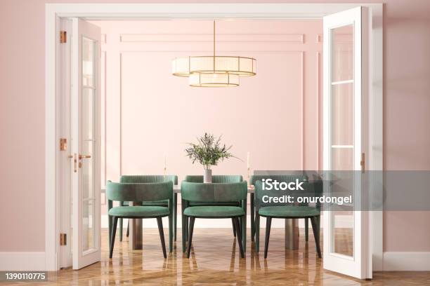 Entrance Of Dining Room With Dining Table Green Velvet Chairs And Pink Wall In Background Stock Photo - Download Image Now