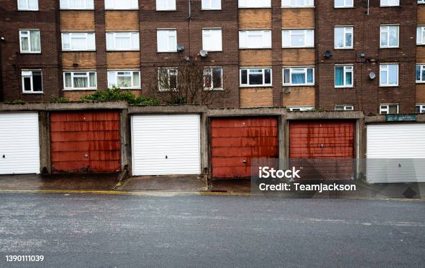 Rows Of Garages And Tenement Blocks On A Council Estate In The North Of England Stock Photo - Download Image Now