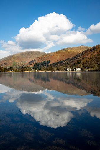 Landscape Reflections of clouds and blue sky in Grasmere Lake in The lake District national Park