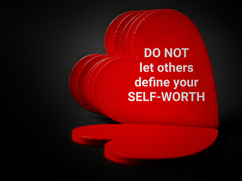 Inspirational and motivational quote of do not let others define your self-worth. Love yourself concept. Stock photo.