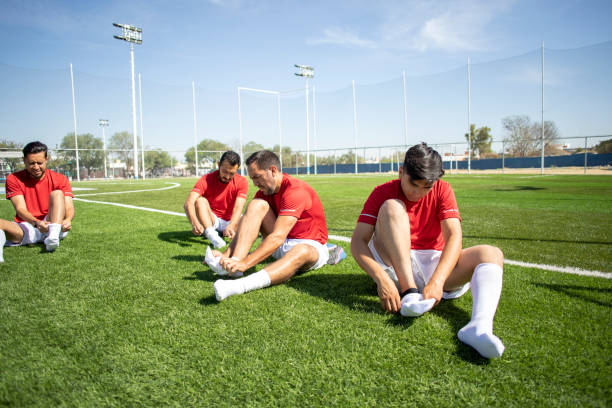 istock Friends playing soccer 1390112435