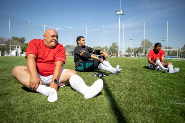 istock Friends playing soccer 1390112508