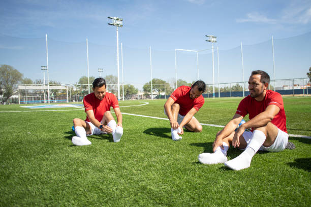 istock Friends playing soccer 1390112544