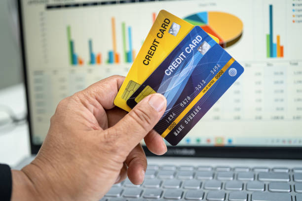 istock Asian accountant working, calculate and analyzing report project accounting with notebook and credit card in modern office, finance and business concept. 1390112559
