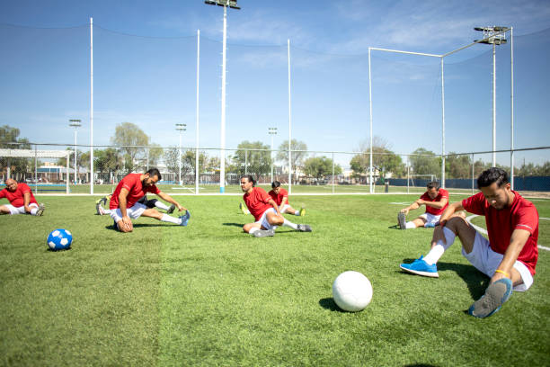 istock Friends playing soccer 1390113884