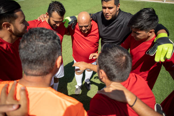 istock Friends playing soccer 1390114019