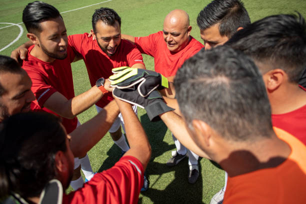 istock Friends playing soccer 1390114189