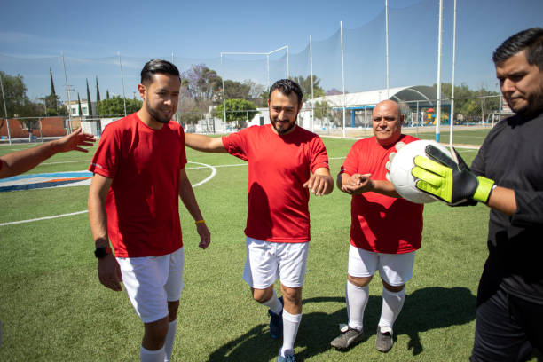 istock Friends playing soccer 1390114204
