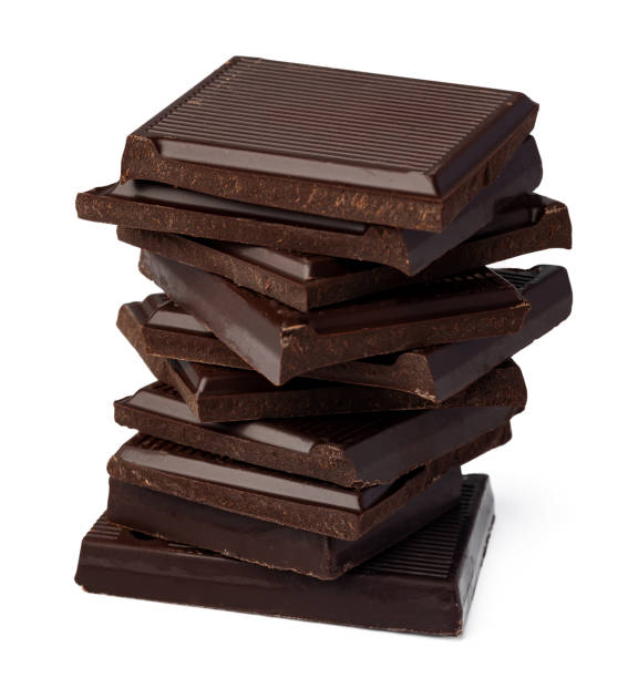 istock Small dark chocolate pieces isolated on white background 1390114243