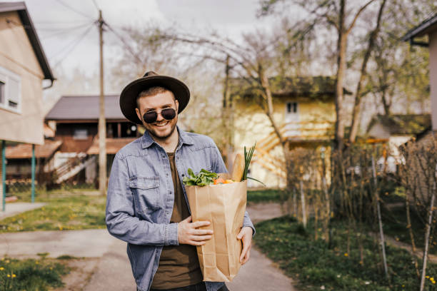 istock Late 20's man going grocery shopping 1390114396