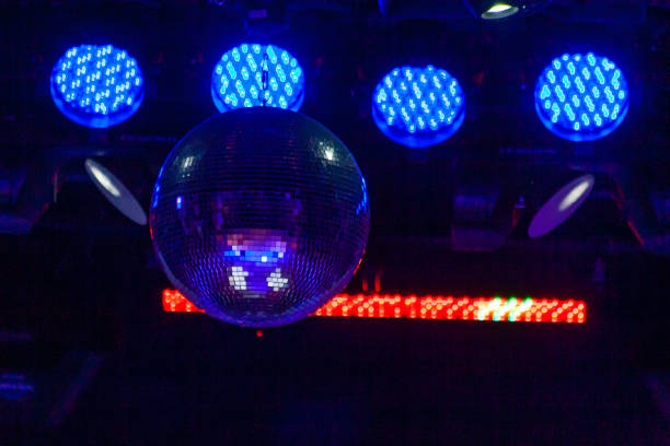 istock Lighting equipment above the stage. Lighting lanterns with a mirror ball. 1390115562