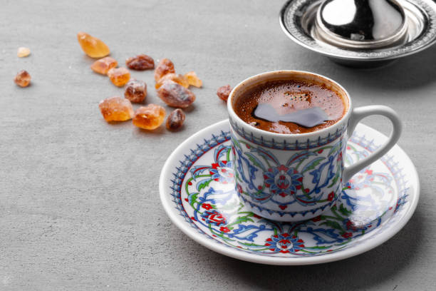 istock Coffee cup and sweet candy on gray table 1390117167