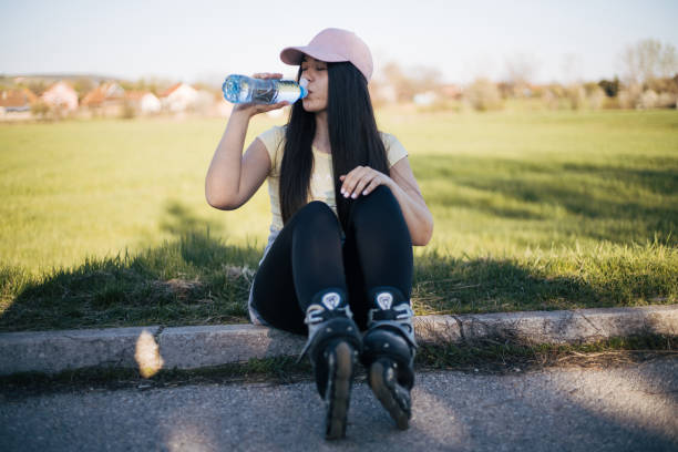 istock Beautiful girl resting from riding roller skaters 1390117875