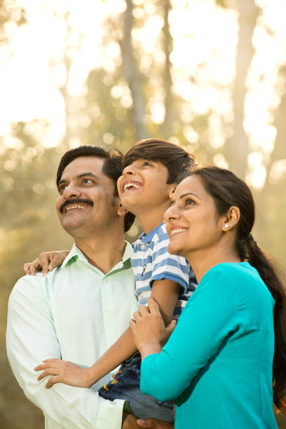 istock Happy family admiring view at park 1390117902