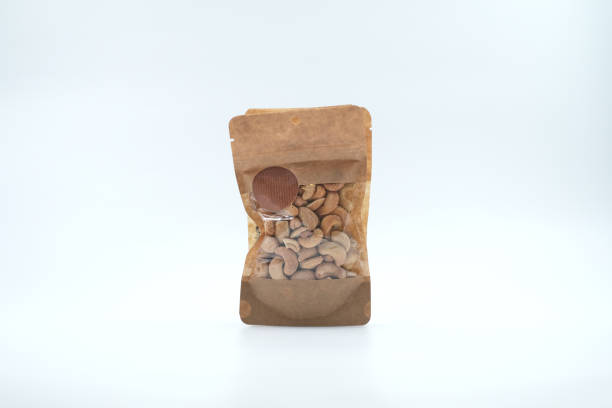 istock Roasted cashews in kraft paper packaging isolated on white background 1390120463
