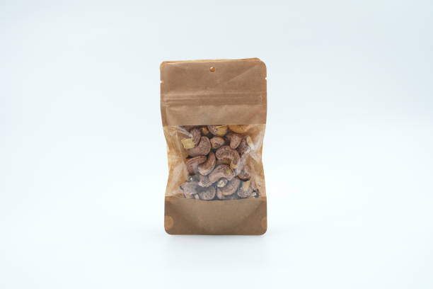 istock Roasted shelled cashews in kraft paper packaging 1390120533