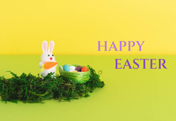 istock Easter composition with decorative rabbits and eggs in the nest 1390123008