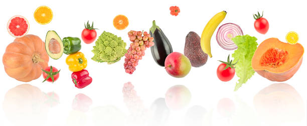 istock Soaring fresh bright vegetables and fruits with light reflection 1390123410