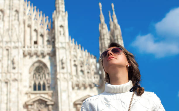 Woman stay in front of the famous Duomo cathedral stock photo