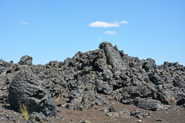 Volcanic features in the Craters of the Moon National Monument in Idaho. Both pahoehoe and aa lavas present in the park. Basaltic lava.  Holocene-aged basaltic lava field. The Snake River Plain is a volcanic province that was created by a series of cataclysmic caldera-forming eruptions which started about 16 million years ago.