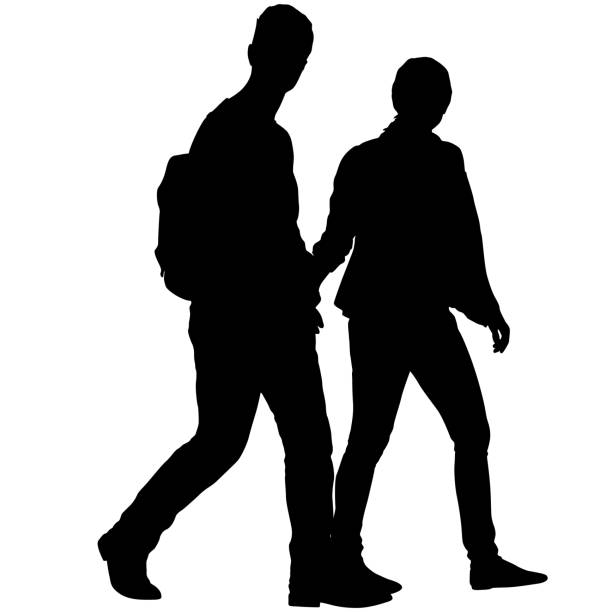 istock Silhouette man and woman walking hand in hand 1390127192