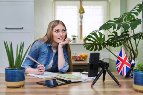 istock Remote distance learning, online lesson of female student using smartphone 1390128567