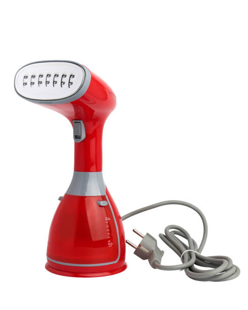 istock Modern household red plastic handheld steamer isolated on white background 1390128877