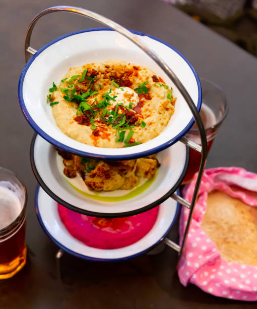 istock Appetizer set Mezze trio of polenta, beetroot hummus and fried cauliflower 1390129721