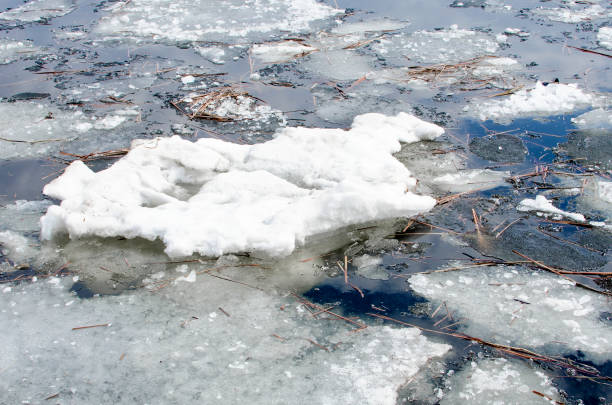 istock Melting ice on the river in spring, close-up. 1390131488
