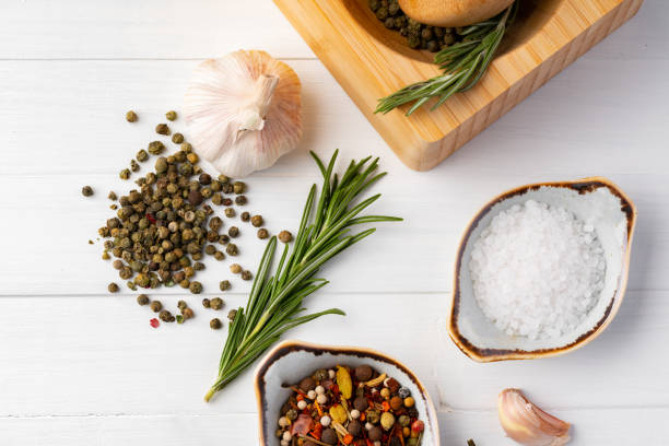 Various spices on white wooden background, close up photo