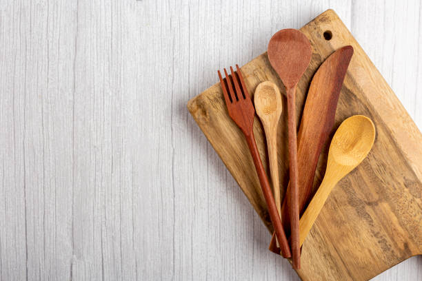 istock Wooden cutlery on wooden table. 1390136759